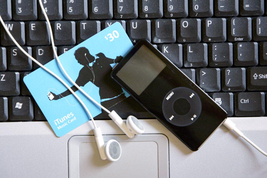 An iPod Nano and iTunes music card on a computer keyboard in Miami on May 7, 2007. (Robert Sullivan/AFP via Getty Images)