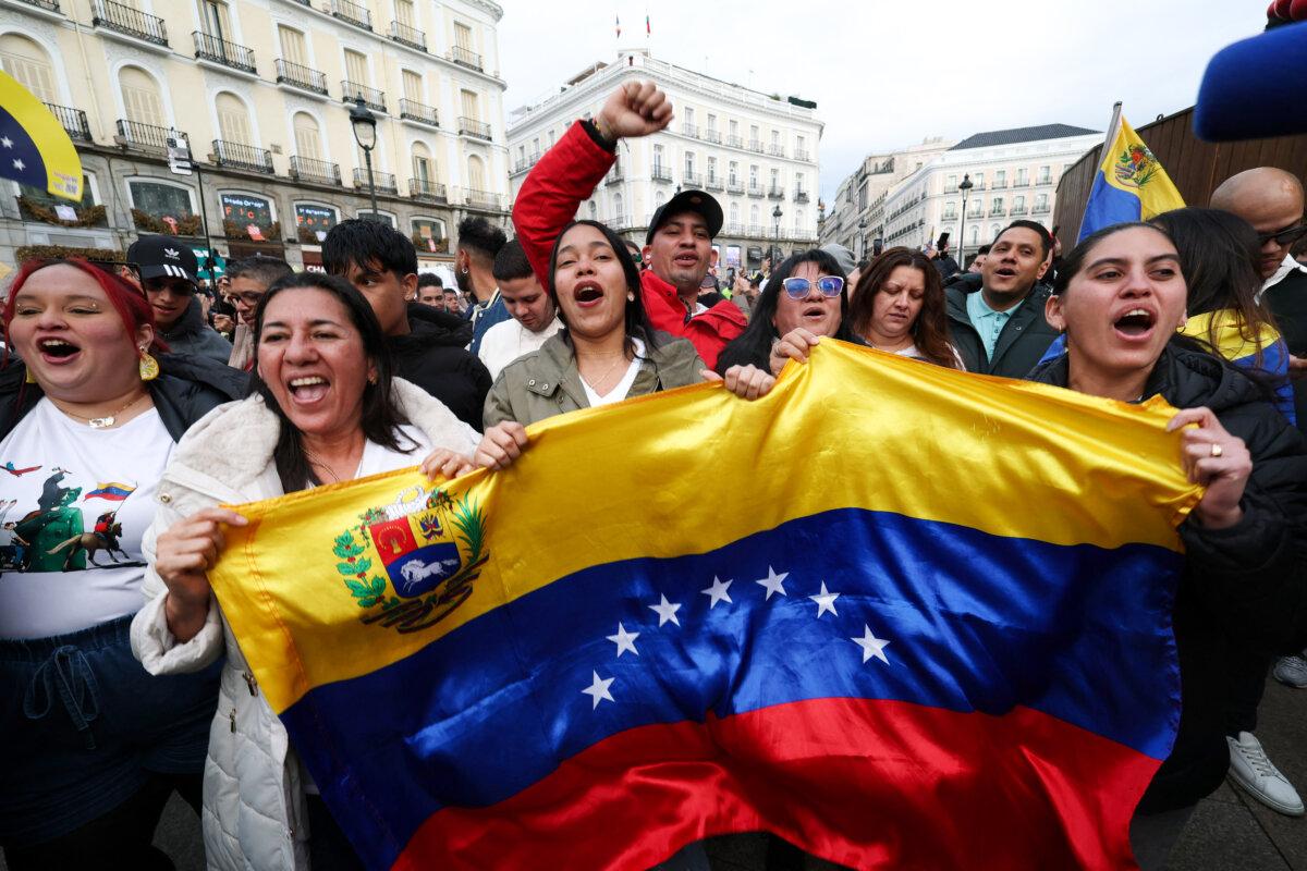 Venezuelan citizens living in Spain celebrate following U.S. forces' capture of Venezuelan leader Nicolás Maduro in Caracas, Venezuela, at Puerta del Sol square in Madrid on Jan. 3, 2026. (Pierre-Philippe Marcou/AFP via Getty Images)