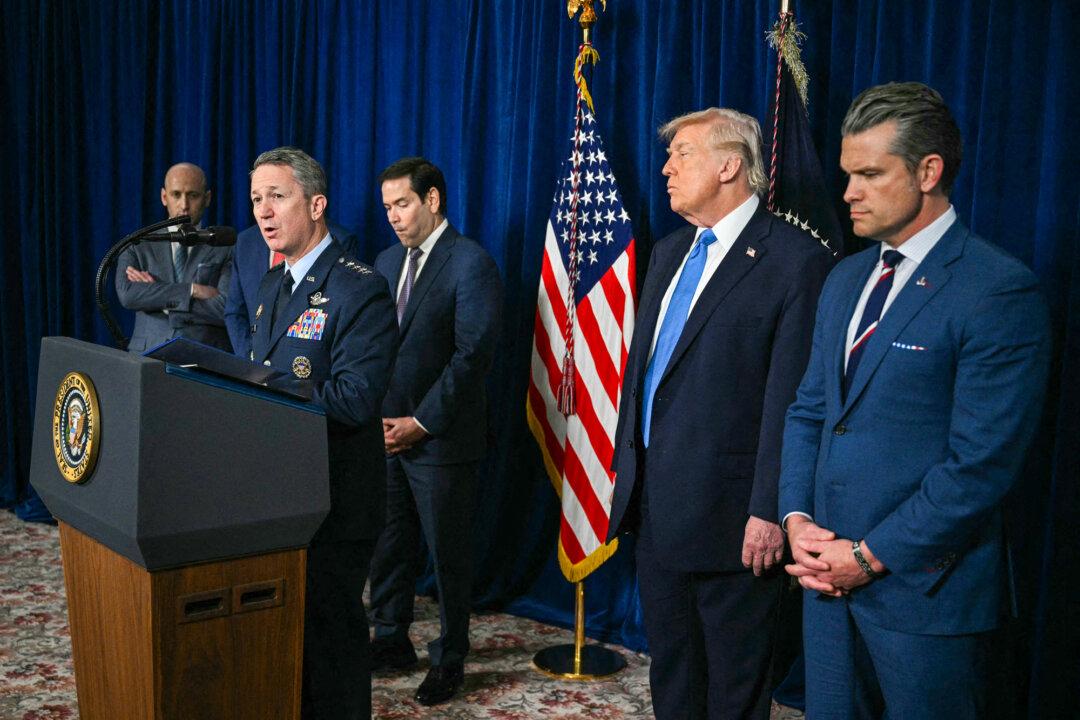 President Donald Trump (2nd R) looks on as Chairman of the Joint Chiefs of Staff Gen. Dan Caine (2nd L) speaks to the press following U.S. military actions in Venezuela, at Mar-a-Lago in Palm Beach, Fla., on Jan. 3, 2026. (Jim Watson/AFP via Getty Images)