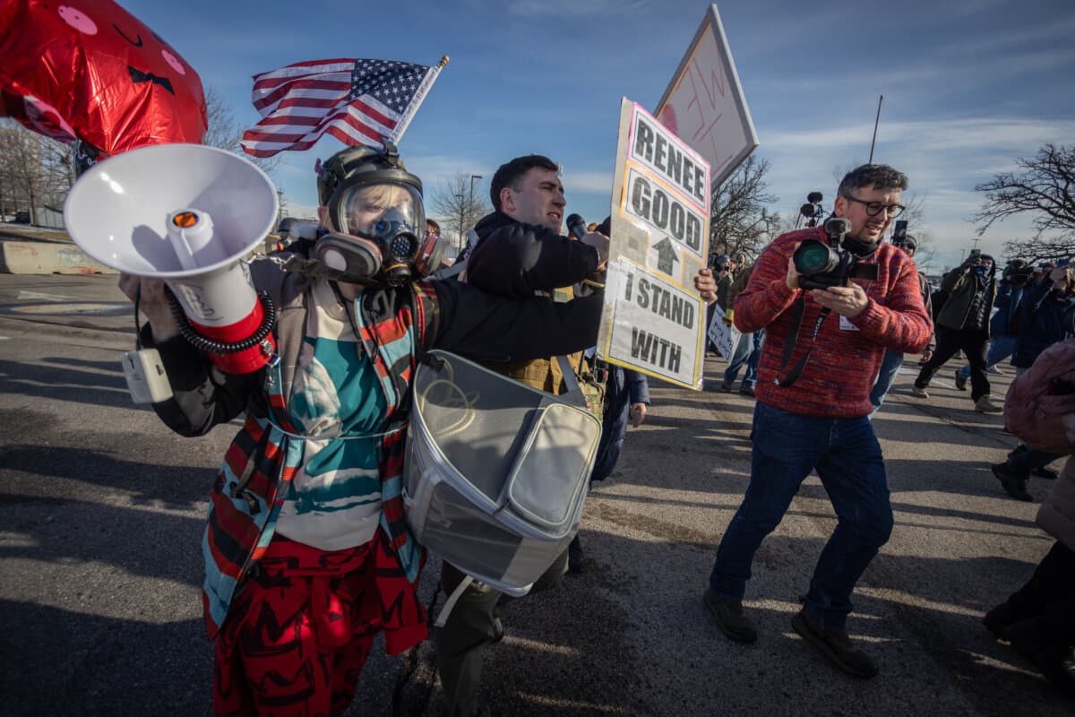 Protesters face off with federal officers in front of the Bishop Henry Whipple Federal Building in Minneapolis, Minn., on Jan. 9, 2026. (John Fredricks/The Epoch Times)