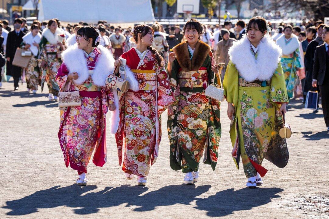 Women wearing kimonos attend a ceremony at Todoroki Arena to mark “Coming of Age Day” honoring those who turn 20 this year, to signify adulthood, in Kawasaki, Kanagawa prefecture, Japan, on Jan. 12, 2026. (Yuichi Yamazaki/AFP via Getty Images)