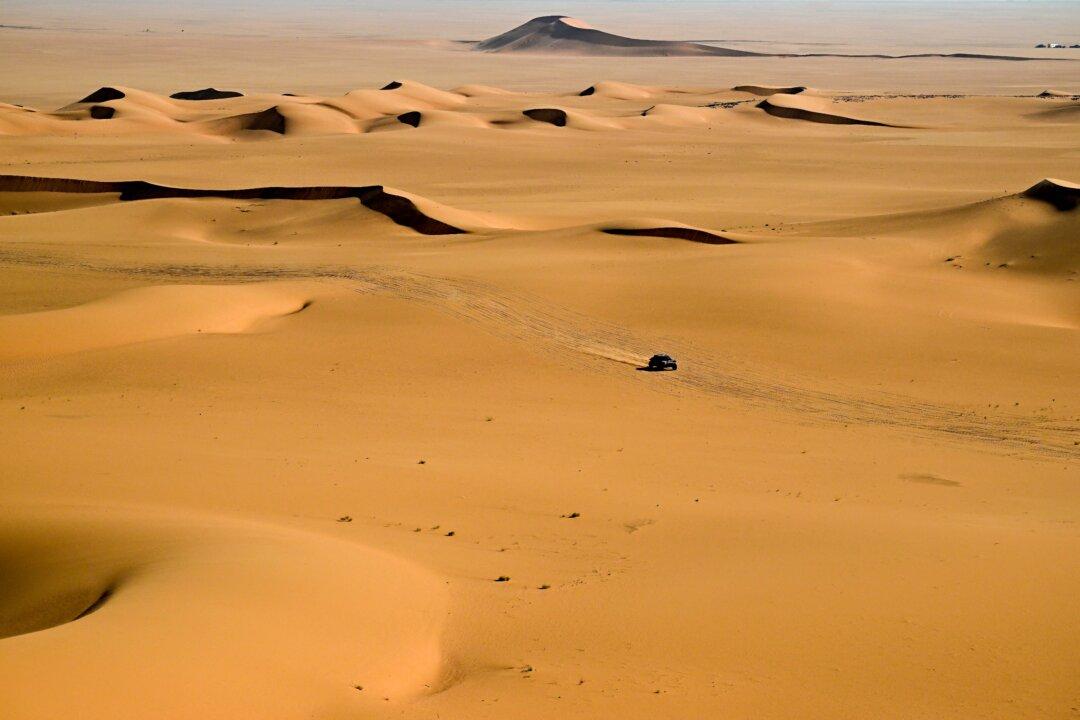 The Dacia Sandrider's Brazilian driver Lucas Moraes and German co-pilot Dennis Zenz compete in Stage 8 of the 48th edition of the Dakar Rally 2026, between Wadi ad-Dawasir and Wadi ad-Dawasir in Saudi Arabia, on Jan. 12, 2026. (Giuseppe Cacace/AFP via Getty Images)