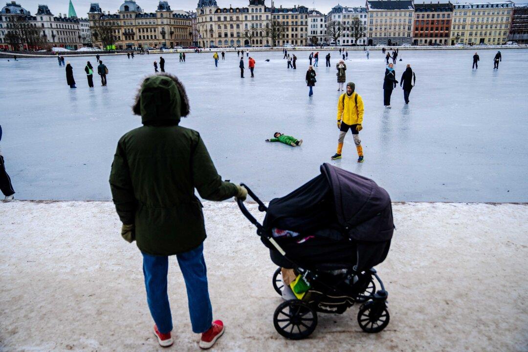 People walk on the ice of frozen lakes in Copenhagen, Denmark, on Jan. 12, 2026. (Sebastian Elias Uth/Ritzau Scanpix/AFP via Getty Images)