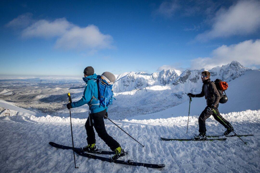 Skiers slide over the snow on a sunny and frosty day on the mountains around Kasprowy Wierch in the Tatra National Park near Zakopane, Poland, on Jan. 12, 2026. (Wojtek Radwanski/AFP via Getty Images)