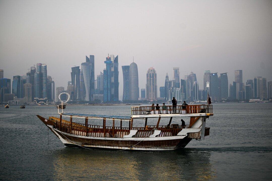 Tourists ride a traditional boat along the corniche promenade in Doha, Qatar, on Jan. 13, 2026. (Mahmud Hams/AFP via Getty Images)