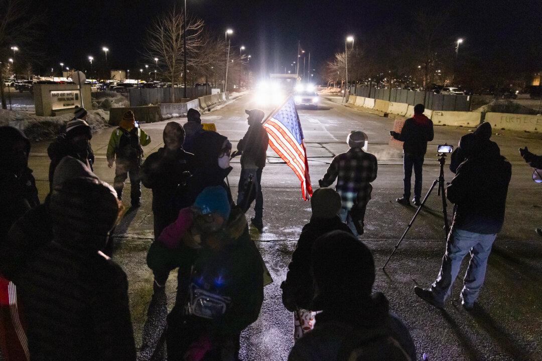 (Top Left) Protesters demonstrate in front of the Bishop Henry Whipple Federal Building in Minneapolis on Jan. 9, 2026. (Top Middle) Federal officers detain a women in front of the Bishop Henry Whipple Federal Building in Minneapolis on Jan. 9, 2026. (Top Right) Protesters demonstrate in front of federal officers and the Bishop Henry Whipple Federal Building in Minneapolis on Jan. 9, 2026. (Bottom Left) Protesters demonstrate in front of federal officers and the Bishop Henry Whipple Federal Building in Minneapolis on Jan. 11, 2026. (Bottom Middle) A protester talks to a sheriff’s deputy (L) in front of the Bishop Henry Whipple Federal Building in Minneapolis on Jan. 11, 2026. (Bottom Right) People protest against federal immigration operations in Minneapolis on Jan 9., 2026. (John Fredricks/The Epoch Times)