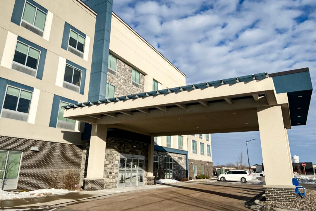 (Top) Protesters march to protest against federal immigration operations in Minneapolis on Jan. 10, 2026. (Left) Fences and “No Trespassing” signs are placed outside the Renaissance Minneapolis Hotel on Jan. 10, 2026. (Right) Hilton severed its partnership with a hotel in the Minneapolis metro area after it allegedly refused reservations from ICE agents. The business has since reopened as the Lakeville Inn and is working to build a website. (John Fredricks, Jacki Thrapp/The Epoch Times)