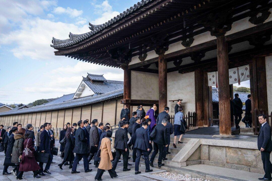 Japan's Prime Minister Sanae Takaichi and South Korea's President Lee Jae Myung walk into the Horyu-ji Temple in Ikaruga, Nara prefecture, on Jan. 14, 2026. (Yuichi Yamazaki/POOL/AFP via Getty Images)
