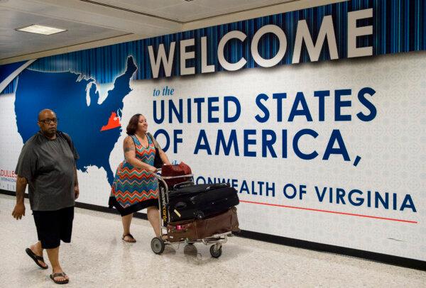 International travelers leave the Customs and Immigration area of Washington Dulles International Airport in Dulles, Va., on June 29, 2017. (Paul J. Richards/AFP/Getty Images)