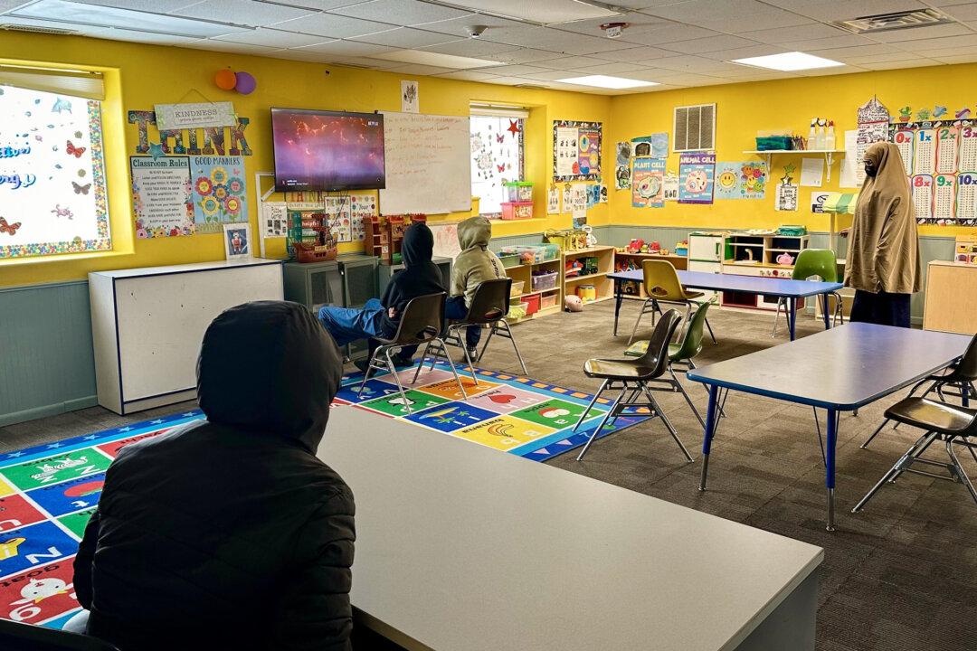 Children watch television at ABC Learning Center in Minneapolis on Dec. 31, 2025. Since 2022, about 90 people—mostly Somalis—have been charged with fraud schemes. (Mark Vancleave/AP Photo)