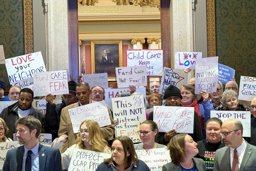 People gather for a news conference at the state capitol in St. Paul, Minn., on Dec. 31, 2025. (Giovanna Dell’Orto/AP Photo)