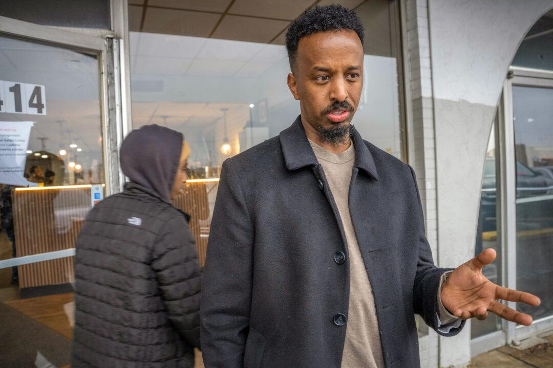 Columbus resident Shirwa Hosh, who came to the United States from Somalia as a child, stands outside Safari Coffee in Columbus, Ohio, on Jan. 6, 2026. (Glenn Hartong for The Epoch Times)
