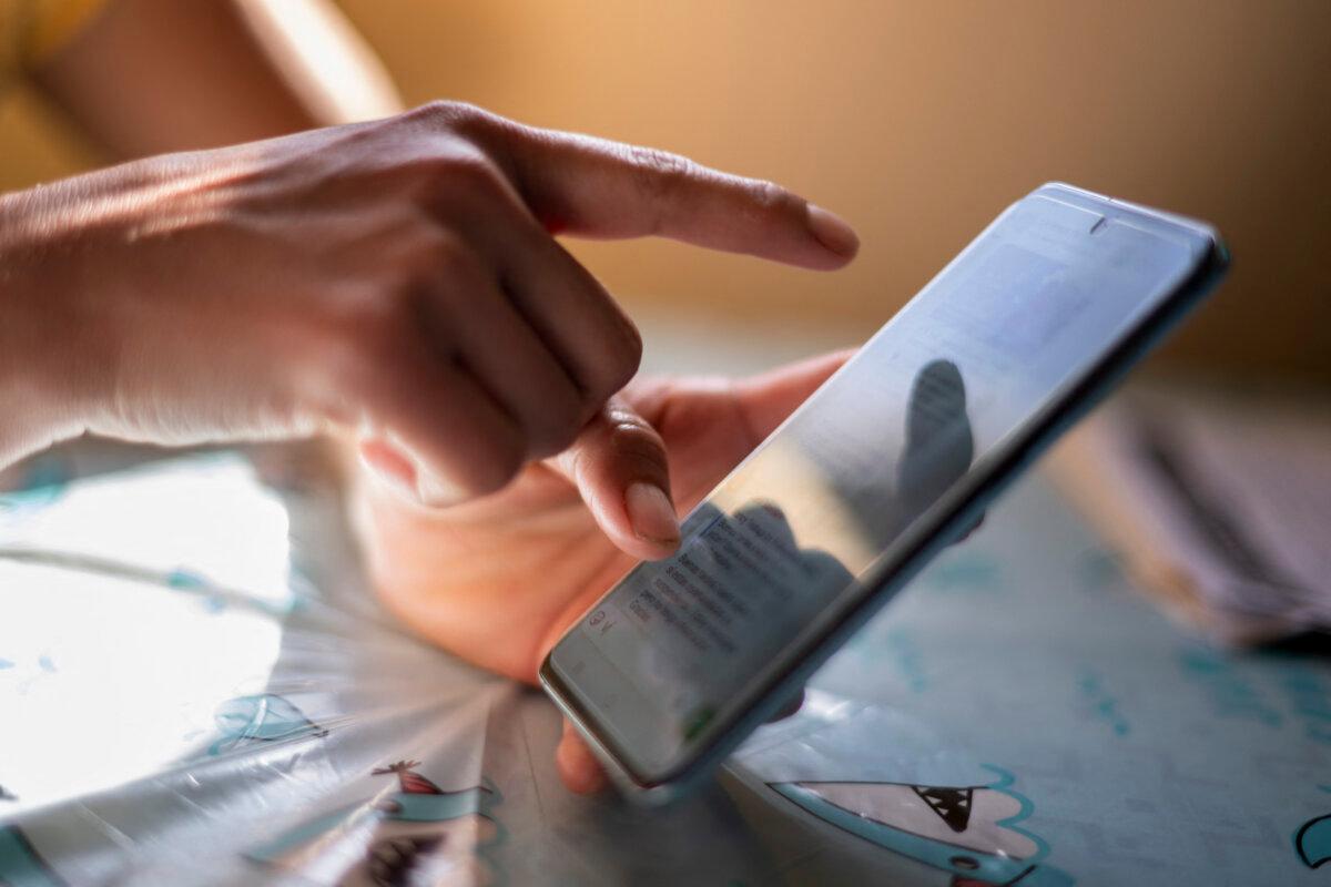 Trigger warnings commonly appear as notices on social media posts. (Stringer/AFP via Getty Images)