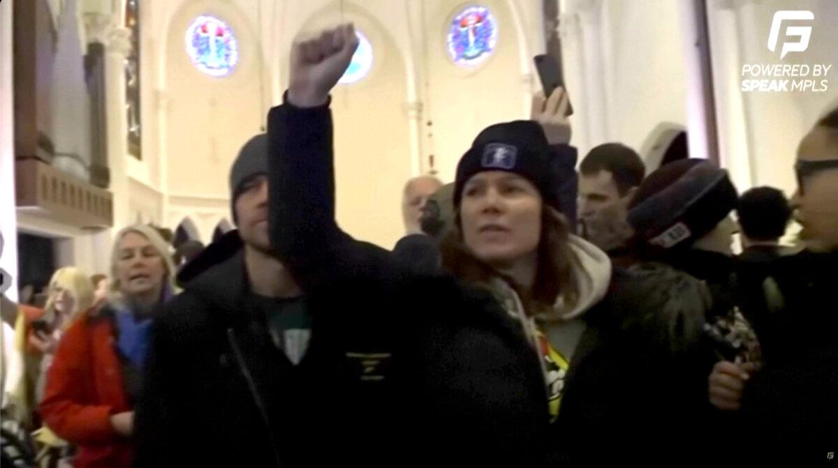 Protesters disrupt services at the Cities Church in St. Paul, Minn., on Jan. 18, 2026, in a still from video. (Speak MLPS via AP/Screenshot via The Epoch Times)