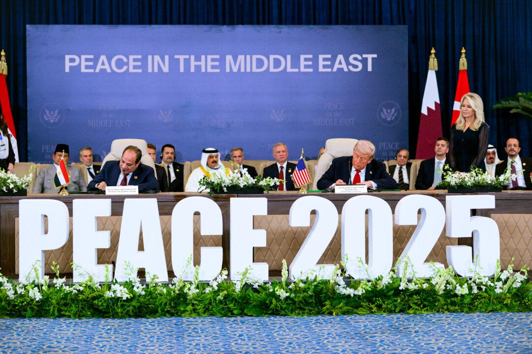 Egyptian President Abdel Fattah El-Sisi and U.S. President Donald Trump sign a Gaza cease-fire agreement in Sharm El-Sheikh, Egypt, on Oct. 13, 2025. Trump was in Egypt to meet with European and Middle Eastern leaders in what was being billed as an international peace summit, following the start of a U.S.-brokered cease-fire deal to end the war in the Gaza Strip. (Chip Somodevilla/Getty Images)