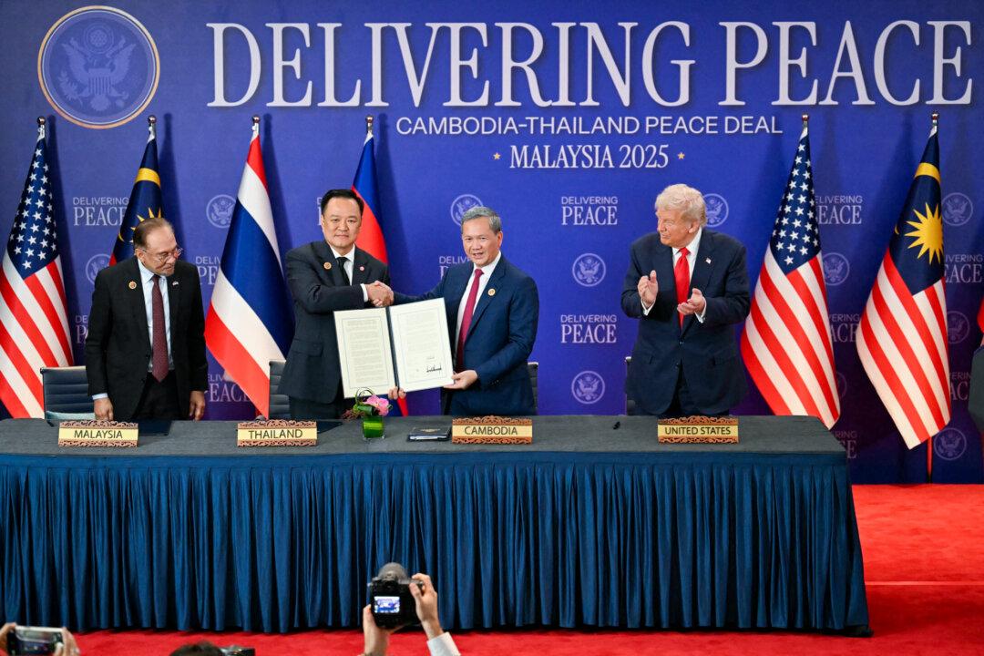 (Left) U.S. President Donald Trump (C) hosts the signing ceremony of a peace deal with Rwandan President Paul Kagame (L) and Congolese President Felix Tshisekedi (R) at the United States Institute of Peace in Washington on Dec. 4, 2025. (Right) Malaysian Prime Minister Anwar Ibrahim (L) and U.S. President Donald Trump (R) watch as Thai Prime Minister Anutin Charnvirakul (2nd L) and Cambodian Prime Minister Hun Manet (2nd R) hold up a document after the ceremonial signing of a cease-fire agreement between Thailand and Cambodia on the sidelines of the ASEAN Summit in Kuala Lumpur, Malaysia, on Oct. 26, 2025. (Andrew Caballero-Reynolds/AFP via Getty Images, Mohd Rasfan/Pool/AFP via Getty Images)
