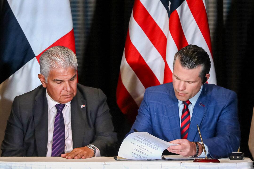 Panamanian President José Raúl Mulino looks on as U.S. Secretary of Defense Pete Hegseth (R) signs a bilateral agreement, in Panama City on April 9, 2025. (Franco Brana/AFP via Getty Images)