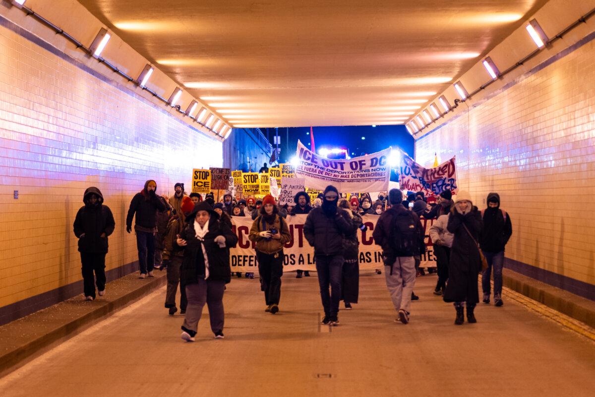 People join a march to protest against Immigration and Customs Enforcement operations, in Washington on Jan. 20, 2026. (Madalina Kilroy/The Epoch Times)