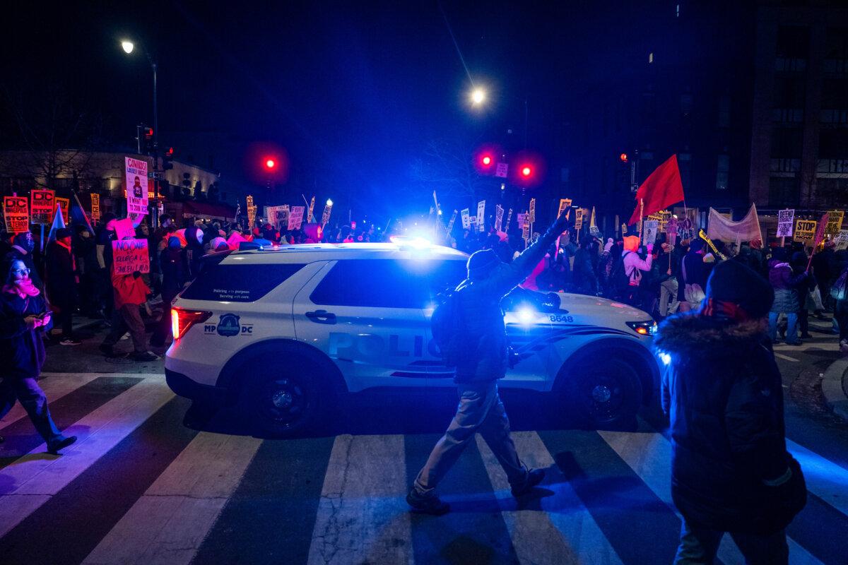 People join a march to protest against Immigration and Customs Enforcement operations, in Washington on Jan. 20, 2026. (Madalina Kilroy/The Epoch Times)