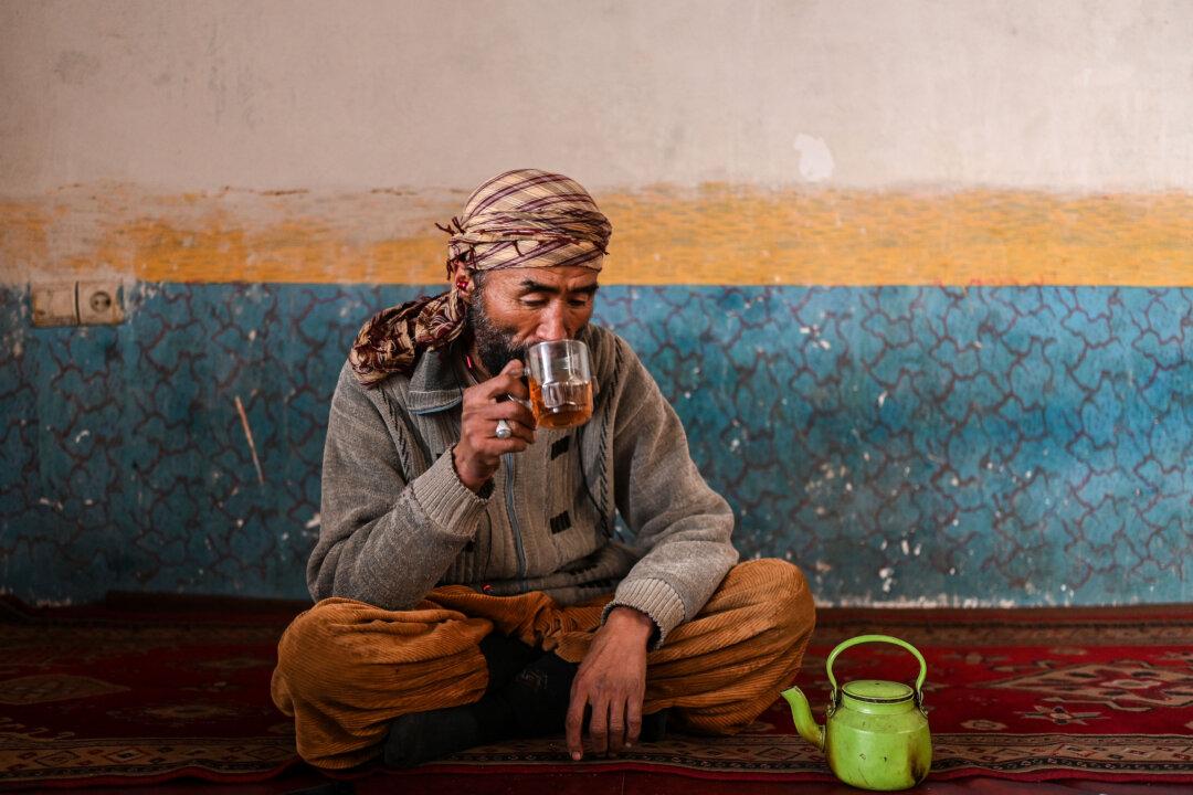 A man drinks tea at a local restaurant at the Siyagerd Bazaar in the Ghorband district of Parwan province, Afghanistan, on Jan. 21, 2026. (Wakil Kohsar/AFP via Getty Images)