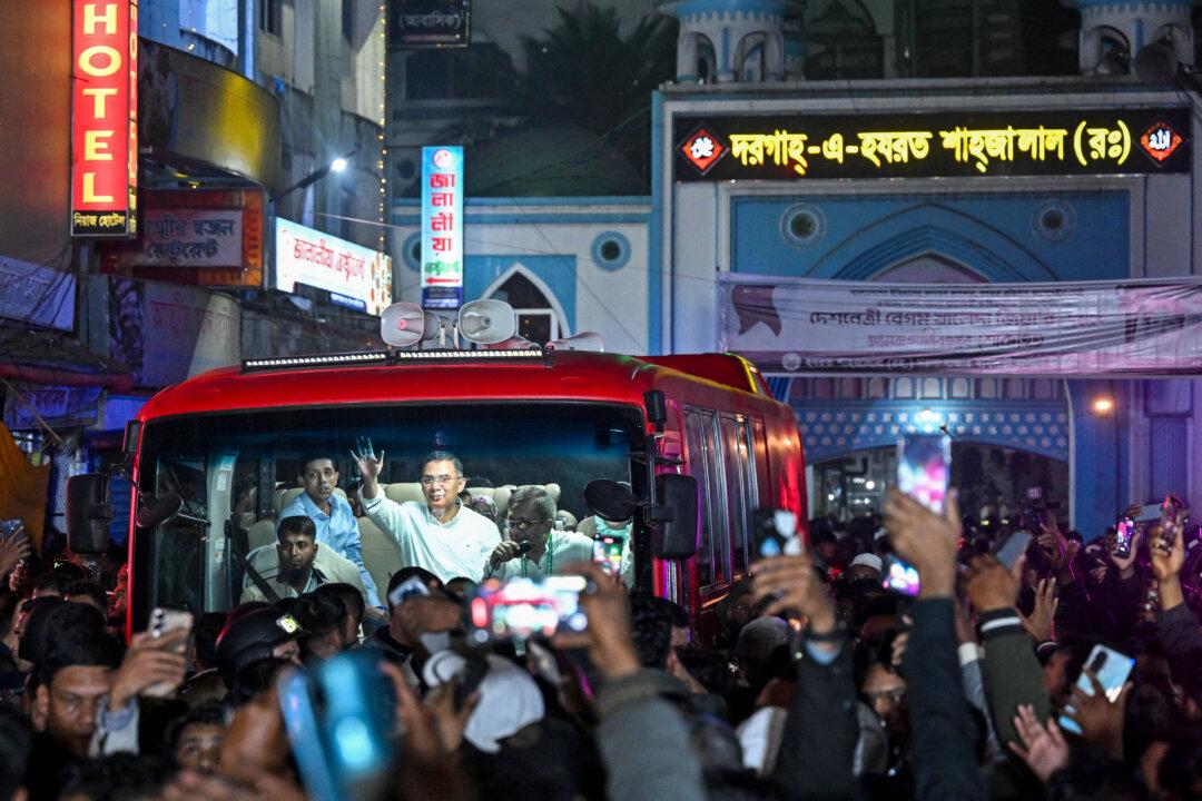 Bangladesh Nationalist Party chairman Tarique Rahman waves to supporters after visiting the shrine of Sufi saint Hazrat Shahjalal in Sylhet, on Jan. 21, 2026, as part of the official launch of his election campaign. (Munir Uz Zaman/AFP via Getty Images)