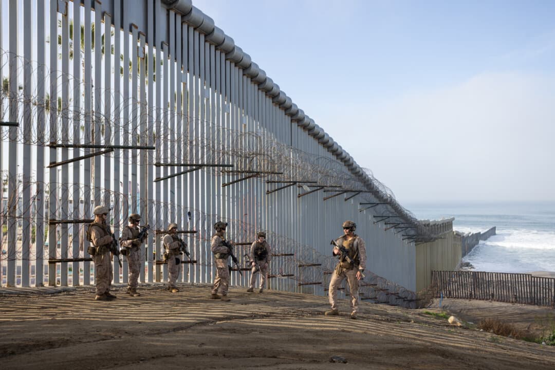 (Top Left) Razor wire installed by U.S. military personnel lines the U.S. border wall outside San Diego on Jan. 20, 2026. (Top Right, Bottom Left-Right) U.S. Marines patrol the U.S.–Mexico border near San Diego on Jan. 20, 2026. About 500 Marines from Camp Pendleton in California were deployed to the Yuma and San Diego sectors to reinforce border barriers. (John Fredricks/The Epoch Times)