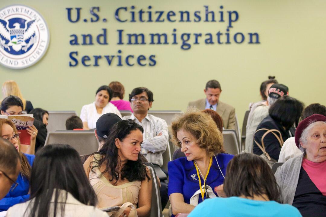 Immigrants await their turn for green card and citizenship interviews at the U.S. Citizenship and Immigration Services (USCIS) Queens office in the Long Island City neighborhood of New York City on May 30, 2013. (John Moore/Getty Images)