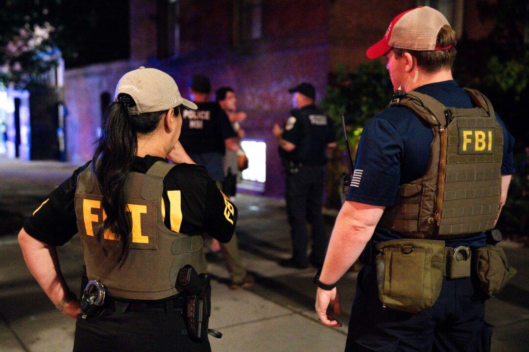 FBI officers on scene after an individual was detained for destruction of property in a restaurant on 14th street in Washington on Aug. 17, 2025. (Kayla Bartkowski/Getty Images)