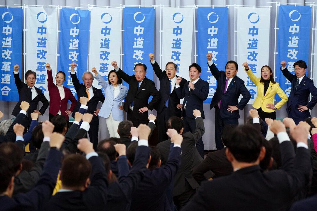 Members of the new opposition party Centrist Reform Alliance, formed as a merger of the Constitutional Democratic Party and Komeito, cheer at the end of their party's founding convention at the Parliament in Tokyo on Jan. 22, 2026. (Kazuhiro Nogi/AFP via Getty Images)