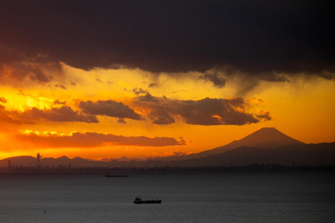 Mount Fuji and industrial facilities are seen from Chiba Port Tower in Chiba city, east suburban Tokyo, on Jan. 22, 2026. (Philip Fong/AFP via Getty Images)