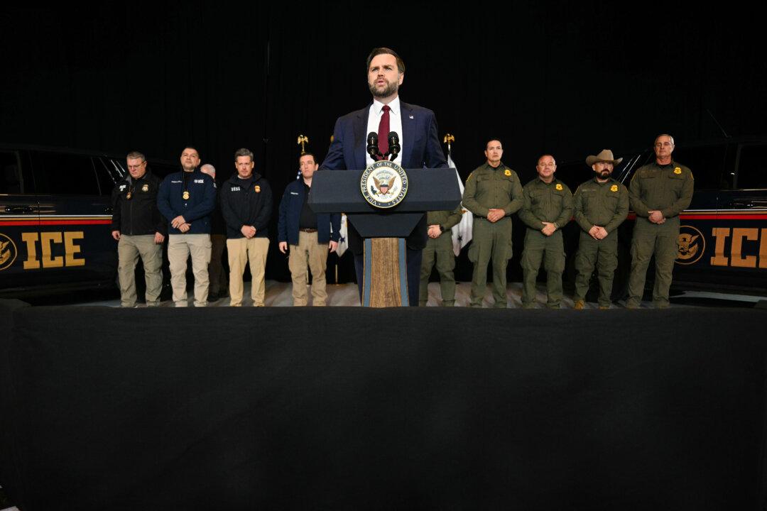 Vice President JD Vance speaks while standing in front of ICE agents after a roundtable discussion with local leaders and community members at Royalston Square in Minneapolis on Jan. 22, 2026, amid a surge of federal immigration authorities in the area. (Jim Watson - Pool/Getty Images)
