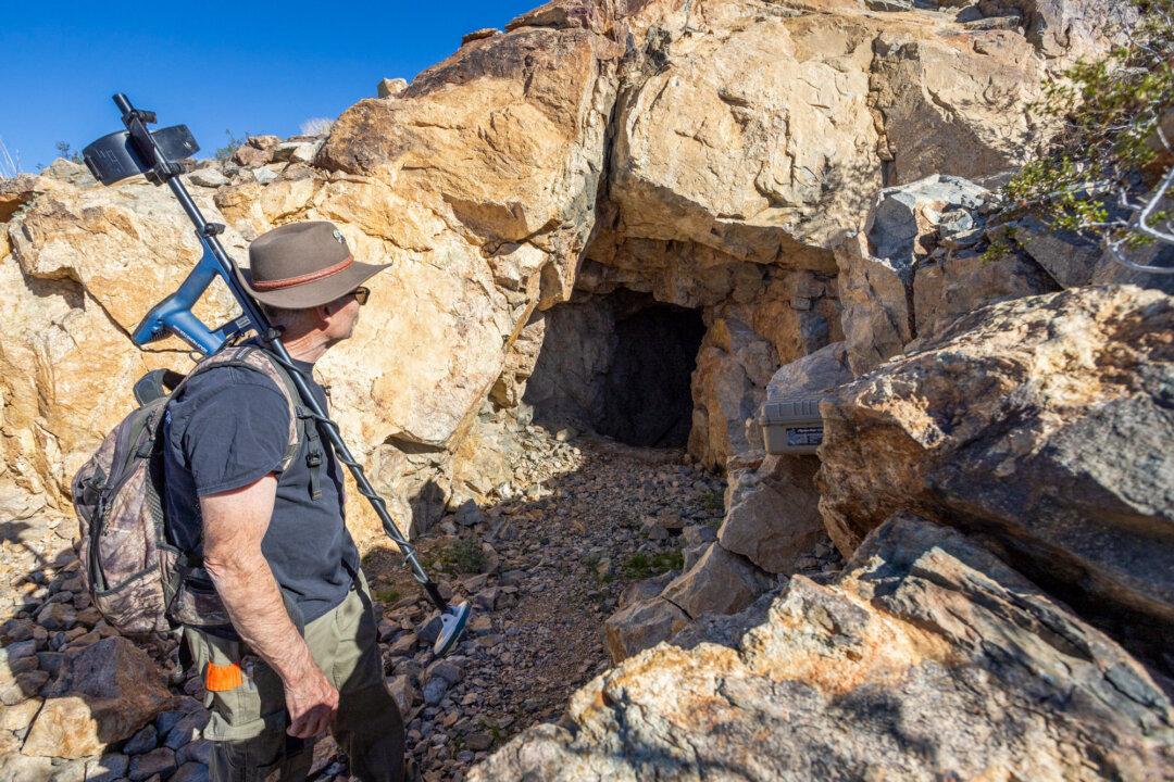 Prospector Ron Kliewer prepares to enter a mine in San Bernardino County, Calif., on Dec. 10, 2025. (John Fredricks/The Epoch Times)