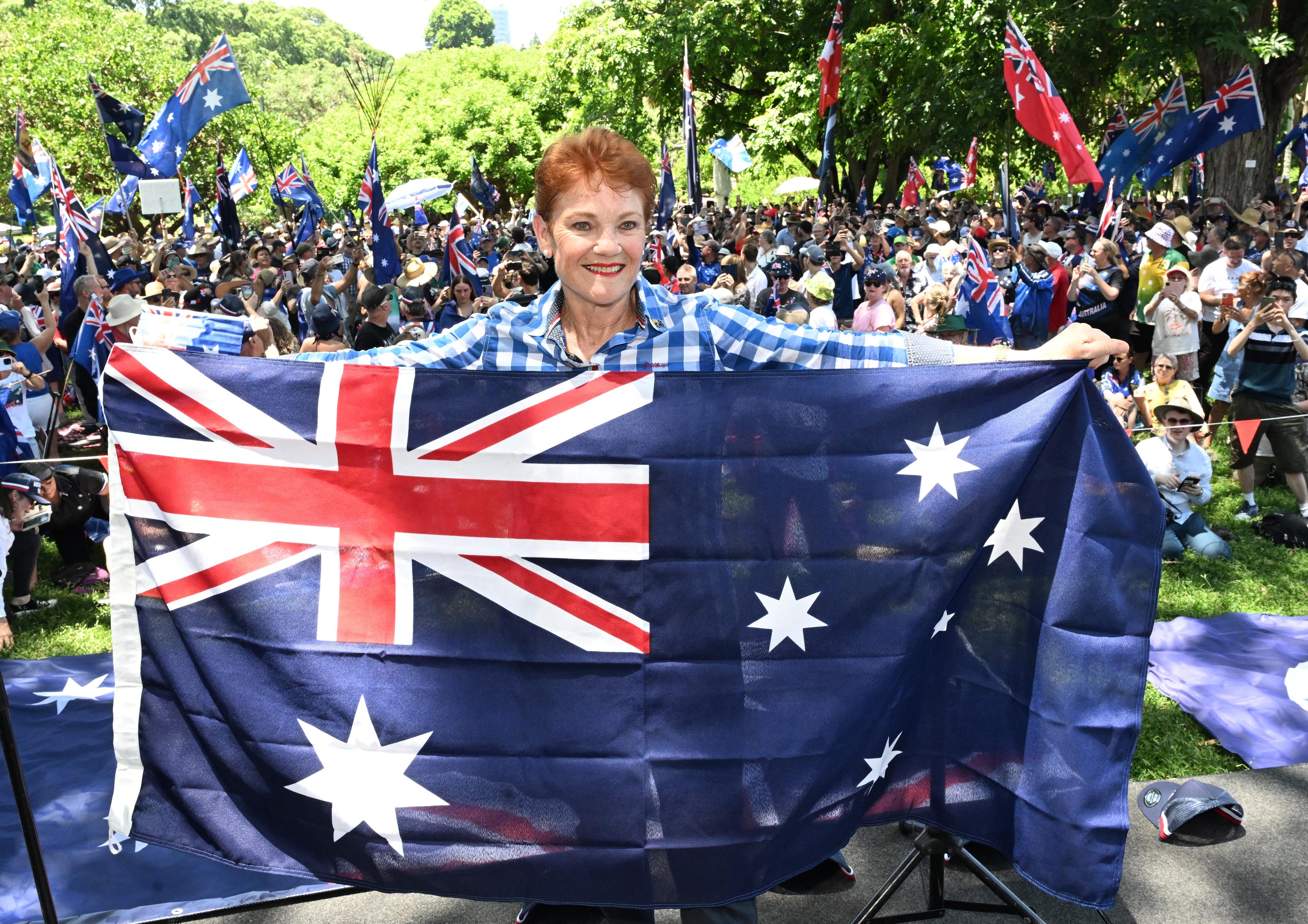 One Nation Leader Senator Pauline Hanson is seen with people attending the Australia Marches rally during Australia Day celebrations in Brisbane, Australia on Jan. 26, 2026. (AAP Image/Darren England )