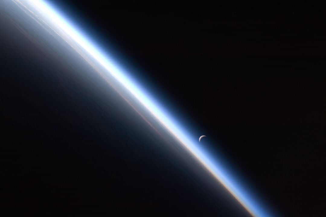 A waning moon sets above the thin line of Earth’s atmosphere in this image taken by an Expedition 24 crew member aboard the International Space Station as it passed over central Asia on Sept. 4, 2010. (NASA/Public Domain)
