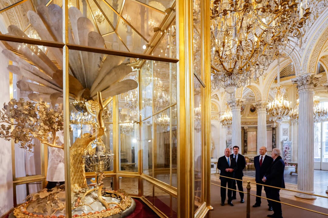 Russian President Vladimir Putin and Malaysia's King Sultan Ibrahim look at the Peacock Clock by James Cox dated from the 1770s, during their meeting at the State Hermitage Museum in Saint Petersburg, on Jan. 26, 2026. (Anatoly Maltsev / POOL / AFP via Getty Images)