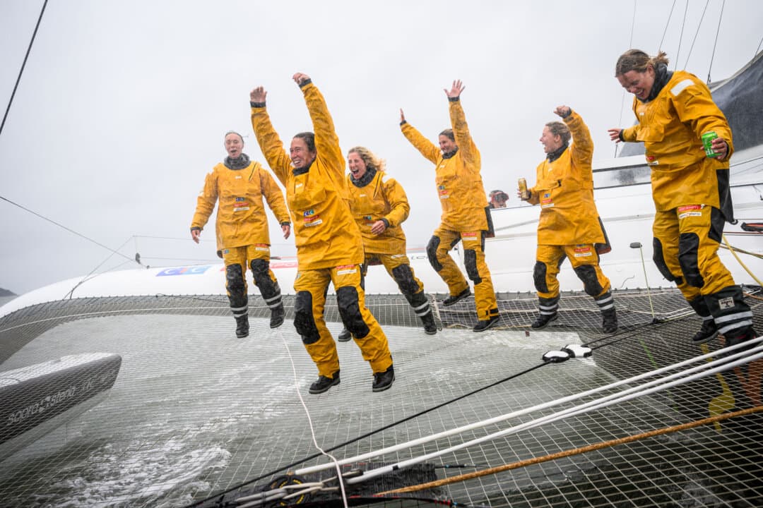 French skipper Alexia Barrier and crew members on the Ultim multihull Idec Sport celebrate their attempt to break the Jules Verne Trophy record as they sail toward harbor after crossing the finish line off the coast of Brest, Brittany, France, on Jan. 26, 2026. Barrier and her six crew members completed the first non-stop round-the-world voyage in a maxi-trimaran with an all-female crew, her team announced. (Loic Venance / AFP via Getty Images)