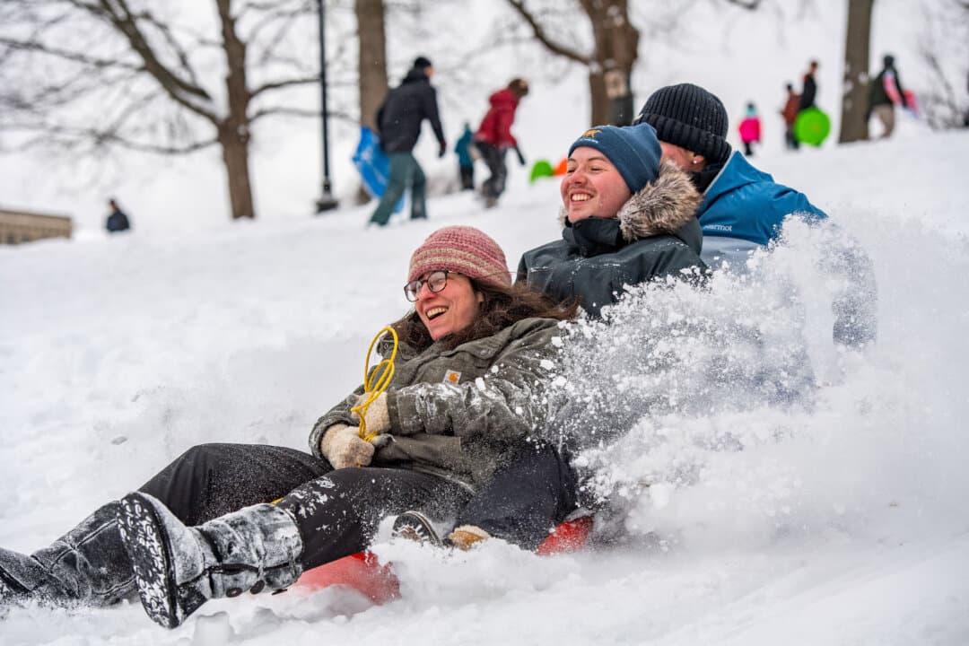 People sled down Flagstaff Hill in Boston Common after a snowstorm in Boston, Mass., on Jan. 26, 2026. (Joseph Prezioso / AFP via Getty Images)