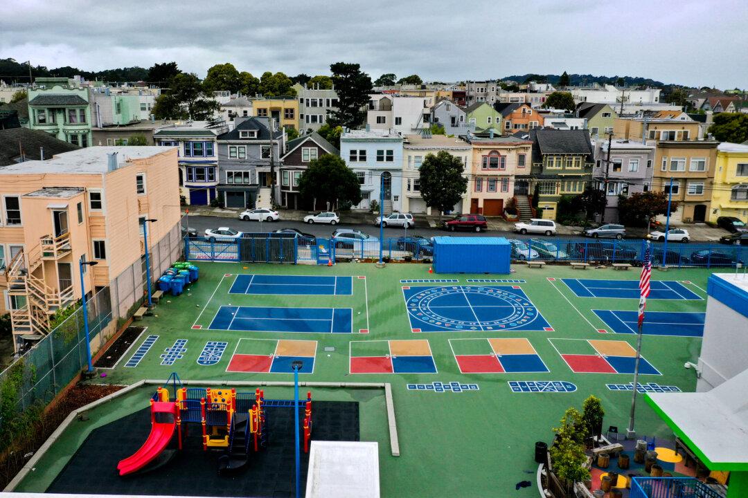 An aerial view of the schoolyard at Frank McCoppin Elementary School in San Francisco on March 18, 2020. State and federal regulations require local school districts to hire more employees and administrators to oversee compliance. (Justin Sullivan/Getty Images)