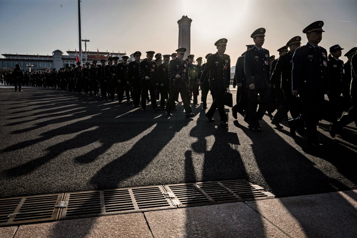 Chinese military delegates arrive at the second plenary session of the National People’s Congress at the Great Hall of the People in Beijing on March 8, 2024. (Kevin Frayer/Getty Images)