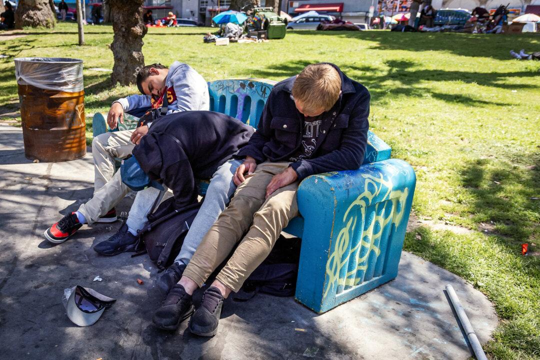 A group of men are passed out after using drugs in Los Angeles on April 10, 2024. Animal tranquilizer medetomidine is being frequently added to fentanyl to extend its effect, according to public health officials. (John Fredricks/The Epoch Times)