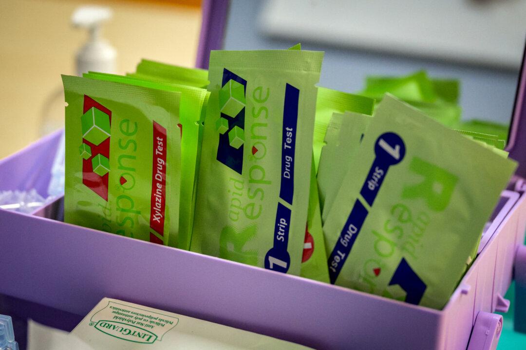 (Left) Drug tests, used to detect the presence of fentanyl and xylazine in different kinds of drugs, such as cocaine, methamphetamine, and heroin, are seen at St. Ann's Corner of Harm Reduction in New York City on May 25, 2023. The tranquillizer, approved for veterinary use by the Food and Drug Administration, has infiltrated the illegal drugs market, with producers increasingly using it to augment fentanyl. (Right) Jonathan Dumke, a senior forensic chemist with the Drug Enforcement Administration, holds vials of fentanyl pills at a DEA research laboratory in northern Virginia on April 29, 2025. (Angela Weiss/AFP via Getty Images, Mark Schiefelbein/AP Photo, file)