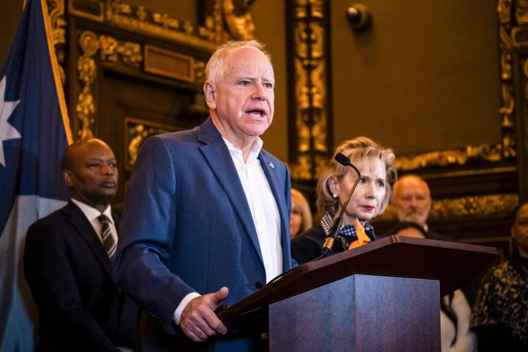 Minnesota Gov. Tim Walz speaks during a press conference at the state Capitol building in St. Paul, Minn., on Feb. 3, 2026. Beginning in late December 2025, the state began using a new pre-payment review vendor called Optum, which uses artificial intelligence in its claims and reimbursement processes. (Stephen Maturen/Getty Images)