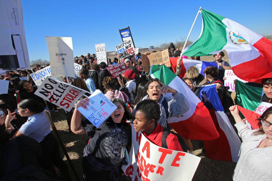 Students from North Forney High School stage a walkout in Forney, Texas, on Feb. 5, 2026. About 200 students protested against Immigration and Customs Enforcement for about 45 minutes. (Bobby Sanchez for The Epoch Times)