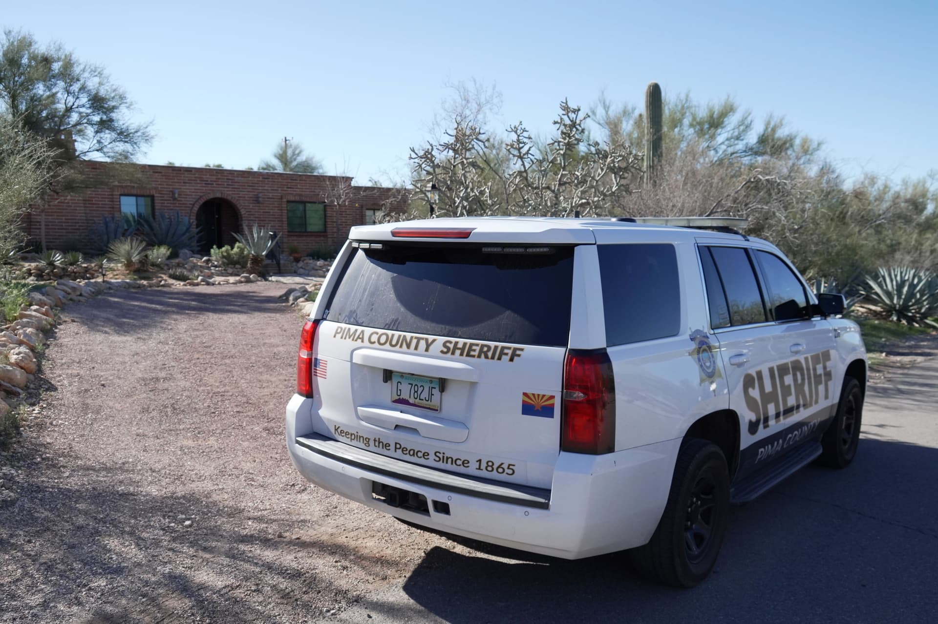 A Pima County sheriff's vehicle is parked at the front of Nancy Guthrie’s home in Tucson, Ariz., Feb. 8, 2026. (Ty ONeil/AP Photo)