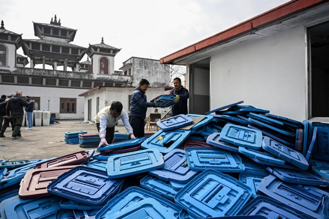Election officials inspect ballot boxes before they are dispatched from the Election Commission office in Kathmandu, on Feb. 9, 2026, ahead of Nepal's general elections. (Prakash Mathema/AFP via Getty Images)