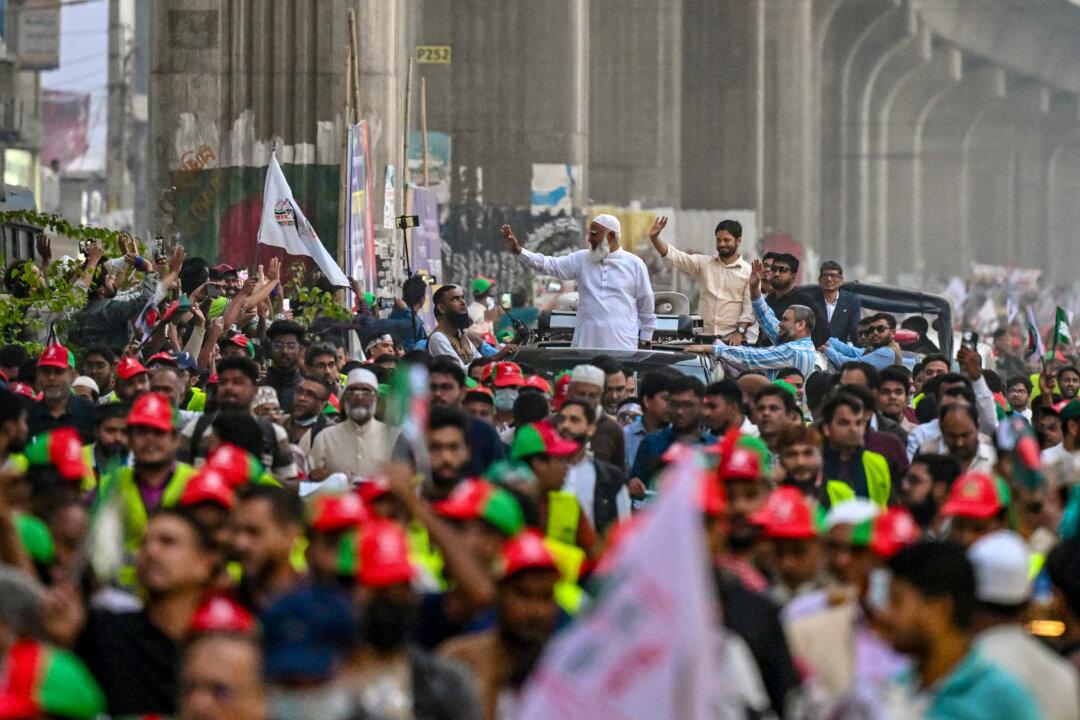 Shafiqur Rahman (C), Jamaat-e-Islami party leader waves to supporters during a rally on the final day of campaigning in Dhaka, on Feb. 9, 2026, ahead of the country's general election on Feb. 12. Bangladesh's election campaign entered its final day with rival parties invoking the 2024 uprising that ended the autocratic rule of Sheikh Hasina. (Munir Uz Zaman/AFP via Getty Images)