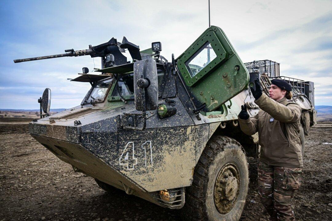 Romanian soldiers operate a High Mobility Artillery Rocket System launcher during the Dynamic Front 26 military exercise at the Cincu Training Area in Cincu, Romania, on Feb. 9, 2026. It's the largest U.S. Army-led artillery exercise ever conducted in Europe, bringing together NATO allies to rehearse the Eastern Flank Deterrence Line through high-tech coordination across land, air, sea, and cyber domains. (Daniel Mihailescu/AFP via Getty Images)