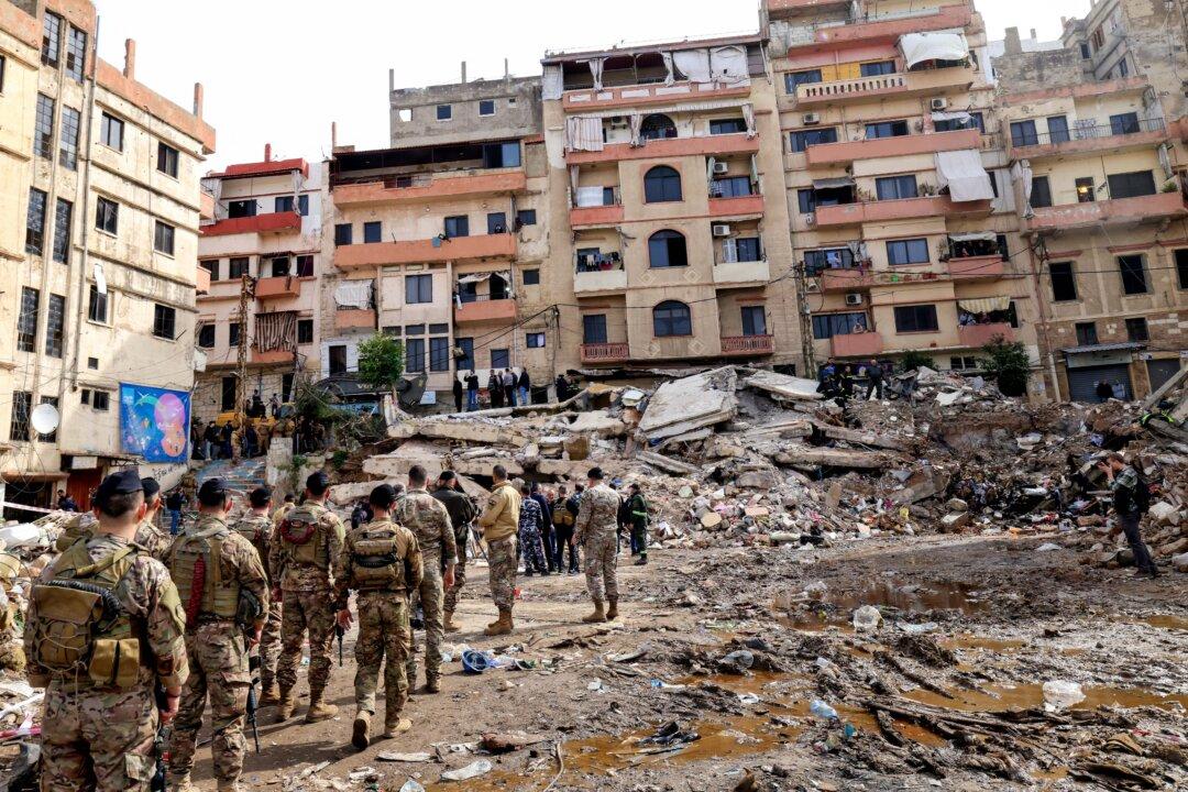 Lebanese soldiers secure the site on Feb. 9, 2026, where an old residential building collapsed in the Bab al-Tabbaneh neighborhood of Tripoli a day earlier. The death toll rose to 14 after search and rescue operations ended, the civil defense chief said. (Anwar Amro/AFP via Getty Images)