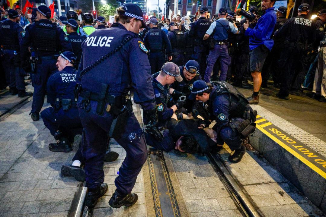 Police detain protesters during a demonstration against the visit of Israel's President Isaac Herzog, in Sydney, on Feb. 9, 2026. Herzog is on a visit Down Under from Feb 8–12 that will take in official engagements as well as meetings with the Jewish community. (Izhar Khan/Getty Images)