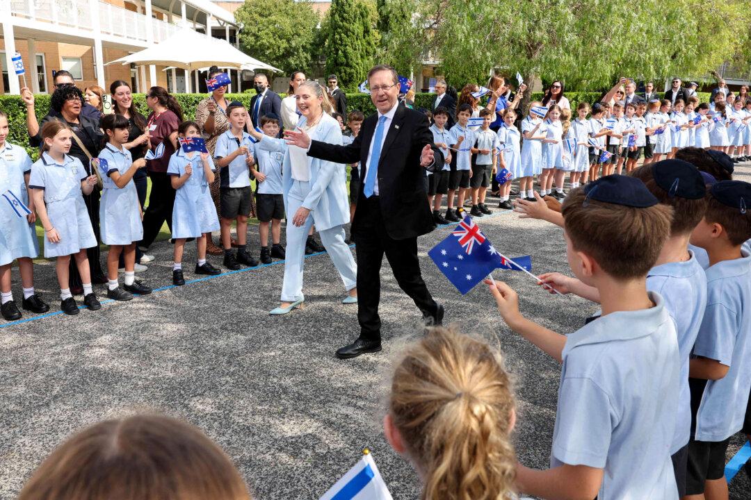 Israeli President Isaac Herzog and his wife, Michal, meet students at Moriah War Memorial College during his state visit Down Under in Sydney, Australia, on Feb. 10, 2026. Herzog's tightly secured, four-day trip aims to console Australia's Jewish community after the December terror shooting at Sydney's Bondi Beach that killed 15 people at a Hanukkah celebration. (Rohan Kelly/POOL/AFP via Getty Images)